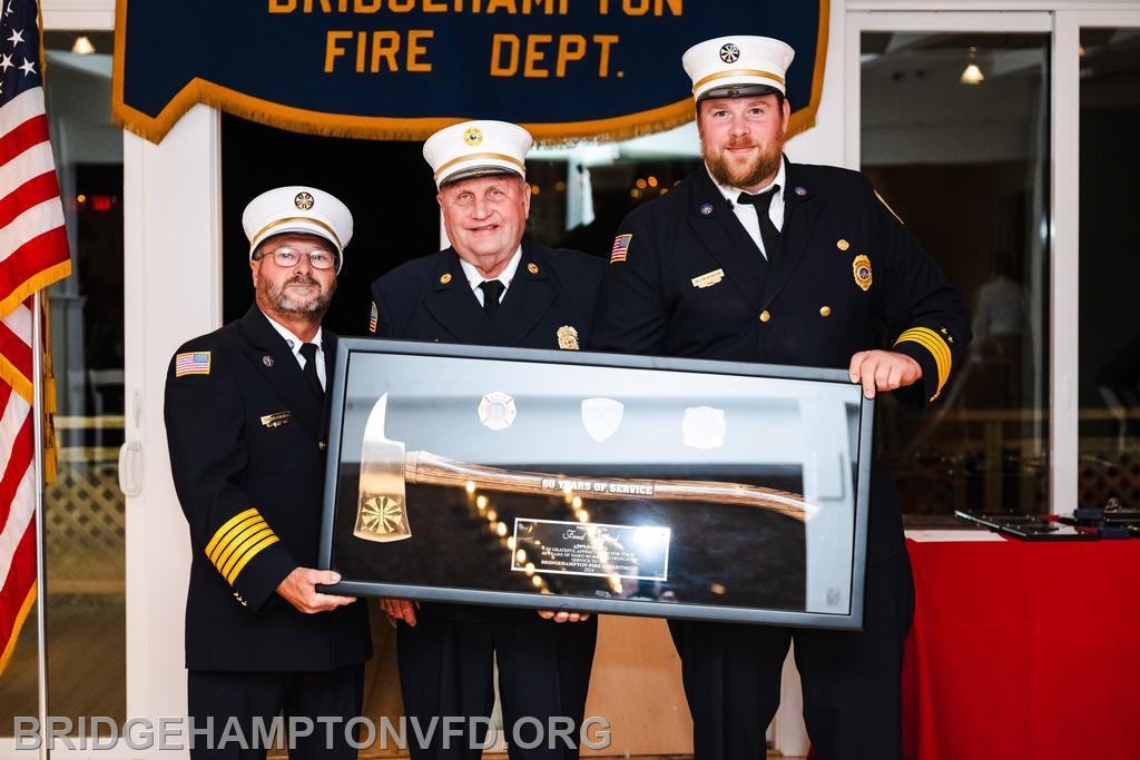 The Bridgehampton Fire Department held our annual inspection dinner recently, where we gathered together to reflect on the past year and honor members for service. At the very top of that list was Ex-Chief Fred Wilford, recognized for a staggering 60 years of service.
He joined the Packard Company in 1964, following in the footsteps of his father, Jimmy Wilford, who happens to have served for 60 years, too. “I didn’t want him to beat me,” Ex-Chief Wilford says with a laugh, assuring us he has no intention of retiring from the fire service anytime soon, “as long as I continue to be able to do what I can do.” 
Except for four years in the Navy, he has lived in Sagaponack his entire life and is a retired LILCO foreman. 
Elected department chief in 1985 and 1986, Wilford has also served the community in several other longstanding ways. For 36 years, he sat on the Sagaponack School Board, before stepping down in 2014. He was on the Bridgehampton Board of Fire Commissioners for 30 years, from which he retired in 2020. Along with Clifford Foster, they are the only two to have served three decades. 
Thank you for your dedication, Ex-Chief Wilford! And cheers to many more years of service!